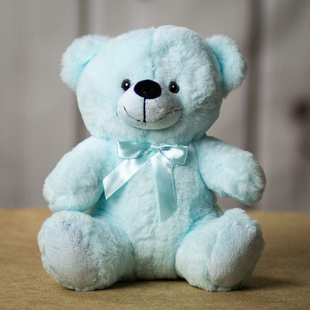 A light blue bear that's 9 inches tall while sitting