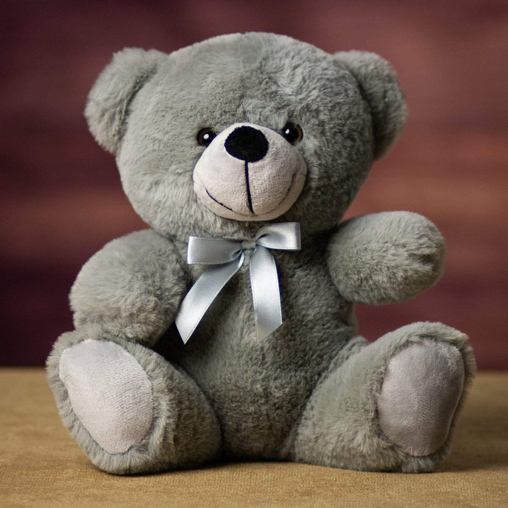 A gray bear that is 9 inches tall while sitting