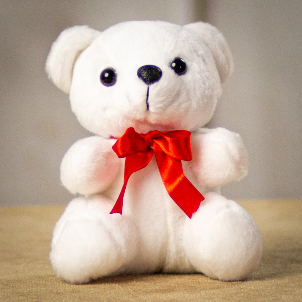 A white bear that is 6 inches tall while sitting