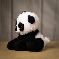Side profile of a scruffy black and white panda that is 9.5 inches tall while sitting