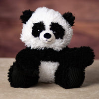 A scruffy black and white panda that is 9.5 inches tall while sitting