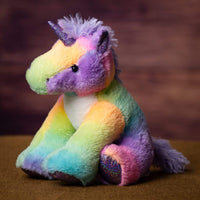 A rainbow unicorn that is 10.5 inches tall while sitting
