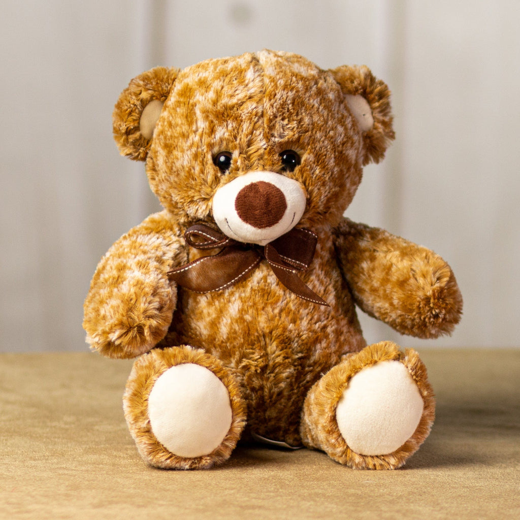 A two-toned brown bear that is 10 inches tall while sitting wearing a brown bow