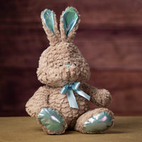 A beige bunny with blueish trim that is 12 inches tall while sitting
