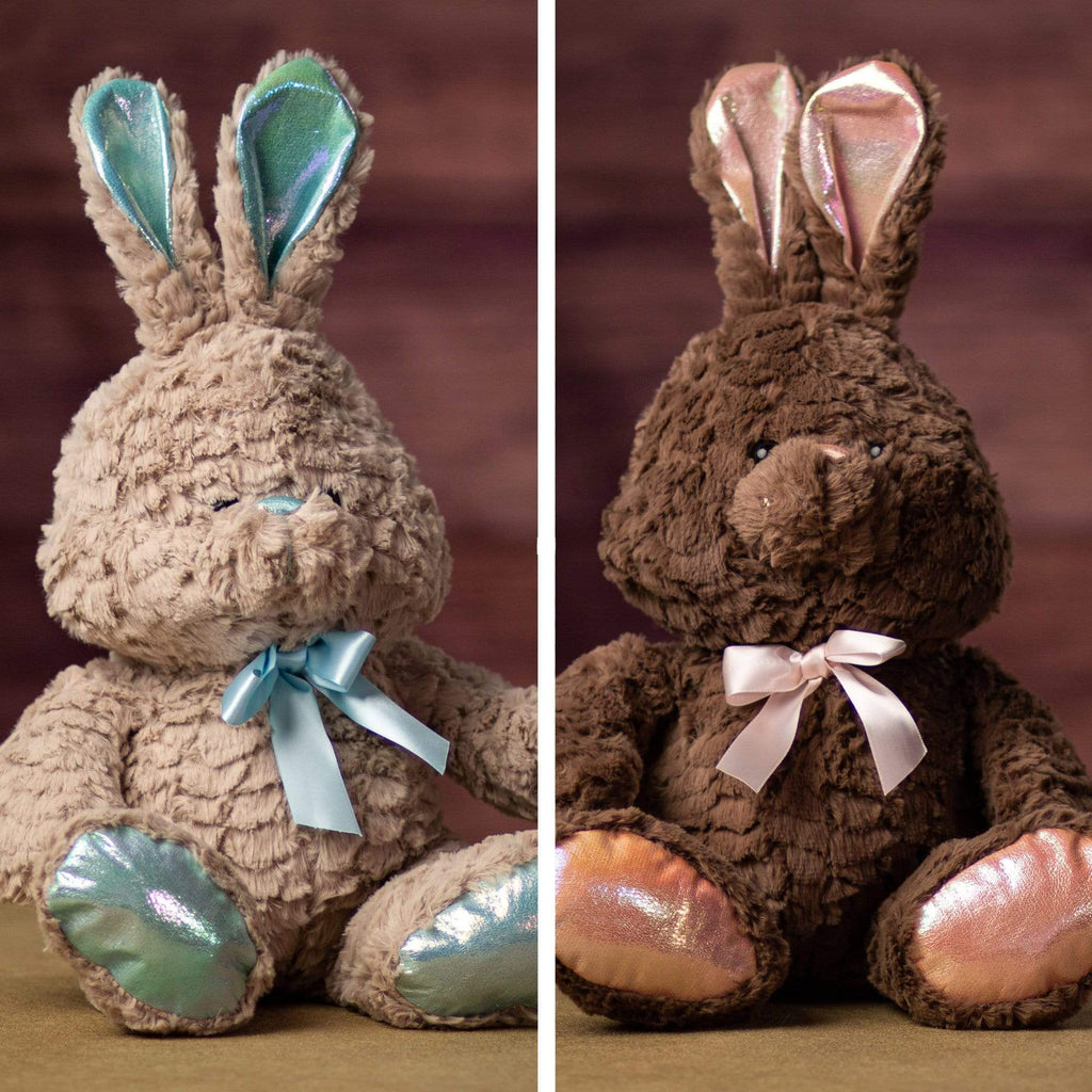 A pair of bunnies that are beige with blueish trim and brown with pinkish trim 12 inches tall while sitting