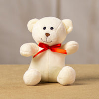 A white bear that is 5.5 inches tall while sitting