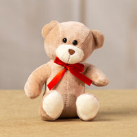 A beige bear that is 5.5 inches tall while sitting