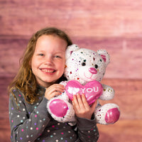 girl holding 10 valentine heart confetti bear duo with i love you heart 