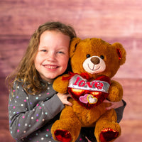 girl holding 14 in brown big valentines bear with shiny love heart