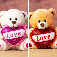 Beige and white bears that are 10 inches tall while sitting with glittery feet and ears holding a glitter "LOVE" heart